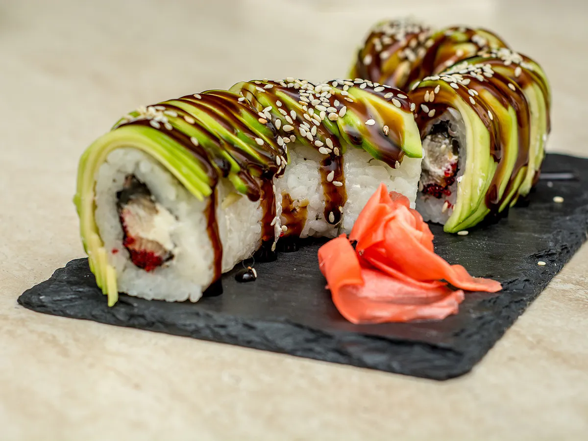 Avocado-topped sushi rolls with eel sauce and sesame seeds at Hinoki Men, a Japanese Restaurant in Rancho Cucamonga